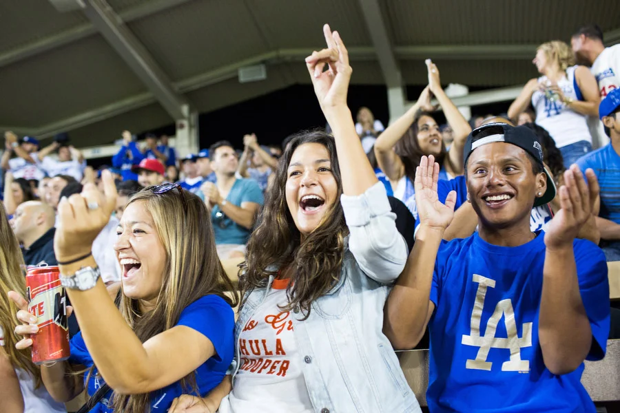 Michael, right, his sister Lacy, center, and her co-worker Kaytee react after the Dodgers kept the Angels from scoring. 