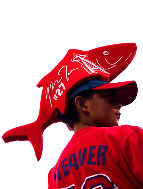 A fan wears a foam hat attachment in the shape a trout, a show of support for Angels outfielder Mike Trout.