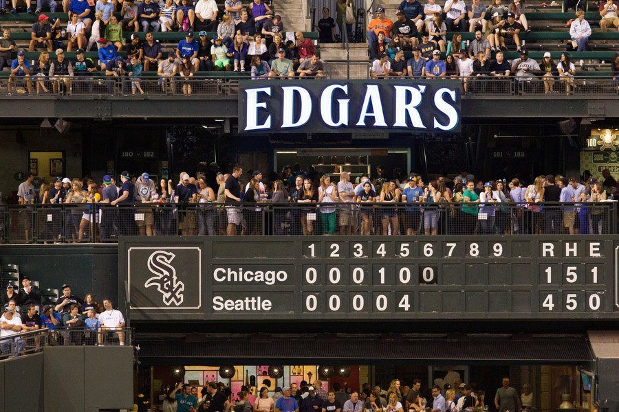 The scoreboard in left field is operated by hand, an homage to the century-old ballparks. 