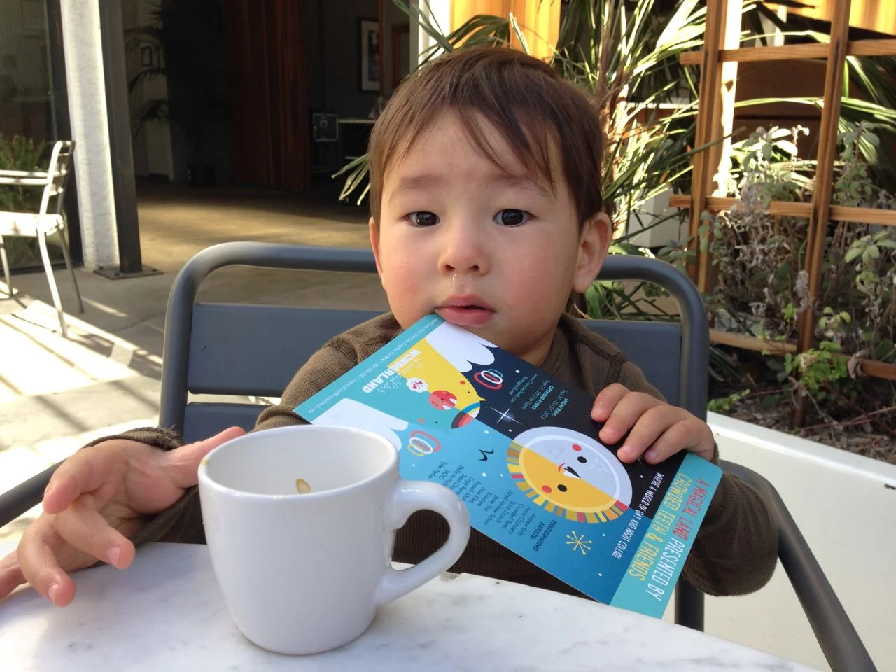 A great picture of a youngster enjoying a delicious shot of espresso