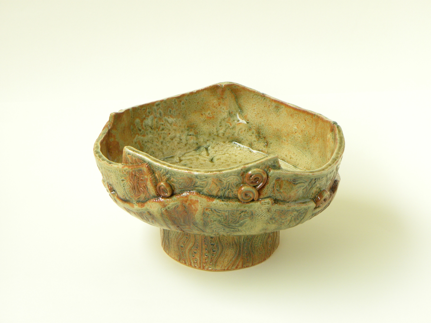 Freeform Slab Pot - sold -- A hand-built bowl made of freeform slabs of clay with a cream breaking rust glaze and copper carbonate stain