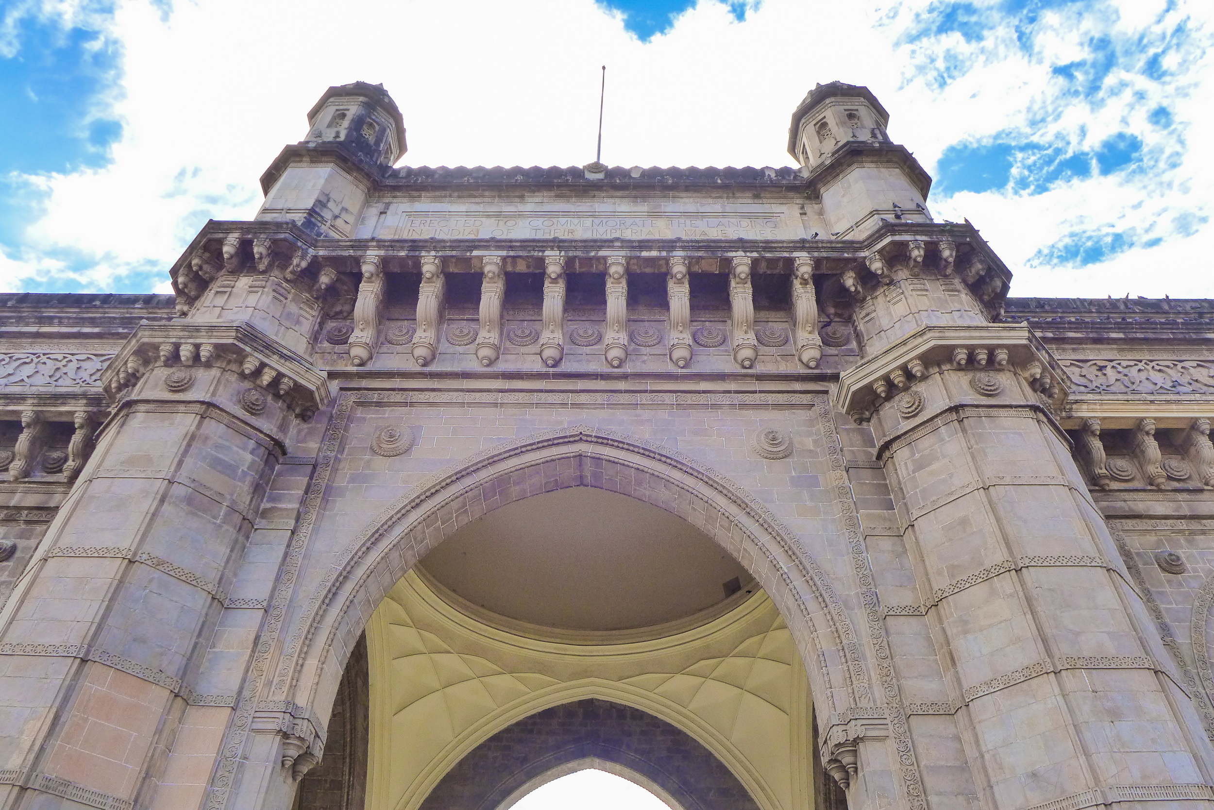 Looking up at The Gateway of India.
