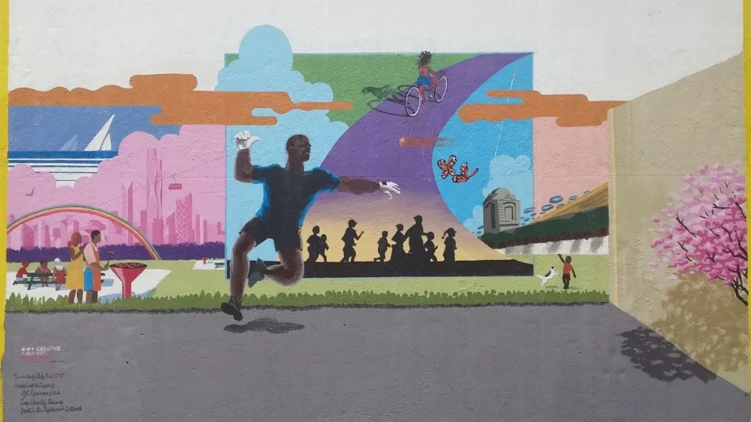 The design for the mural was based on a CAW survey of local residents and includes families enjoying a picnic, a girl riding a bicycle, a boy playing with his dog, sailboats and views of a futuristic New York City skyline and an iconic image of a man playing handball.