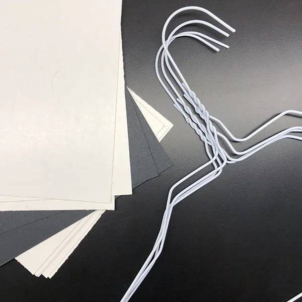 You will need wire coat hangers and some sort of stiff cardboard . We used 6-ply railroad board, but oak tag, cardboard from cereal boxes or postcards could work.