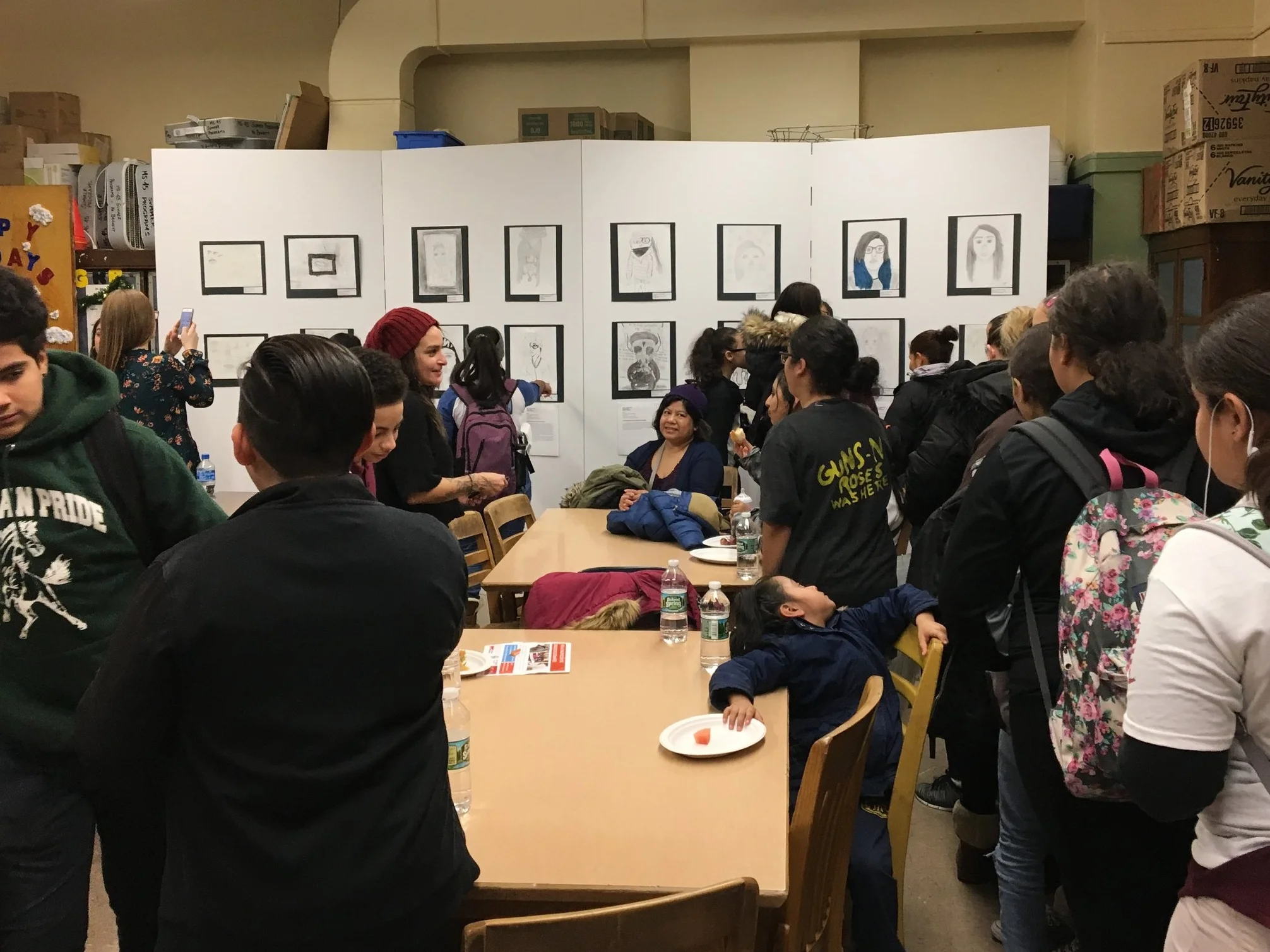 At the opening of a pop-up gallery of student drawings at MS 45 in Fordham, students acted as docents for each other’s work, which reduced the pressure to talk about themselves.
