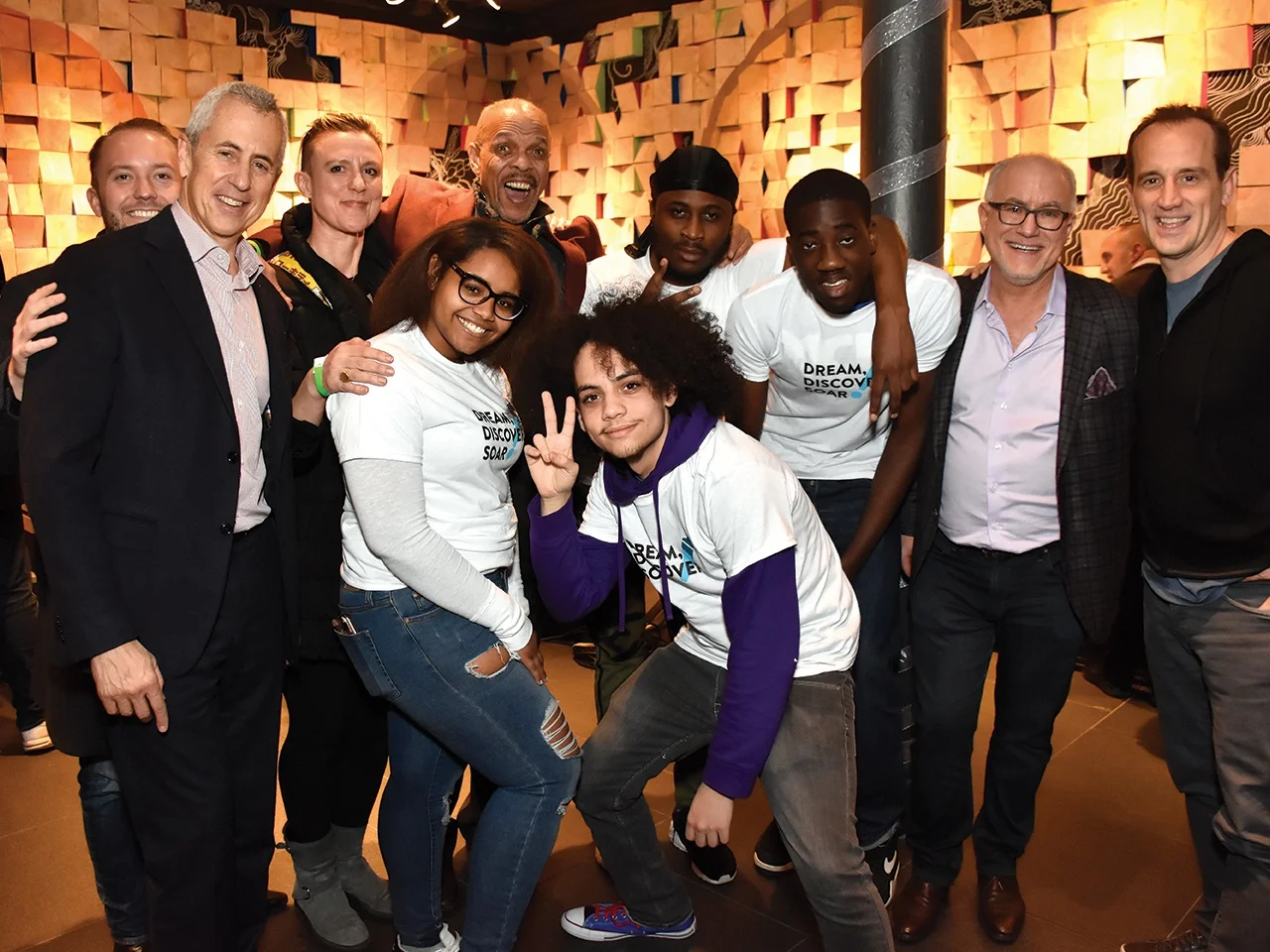 From left, Shake Shack Chief Development Officer Andrew McCaughan, Shake Shack Founder Danny Myers, CAW Teaching Artist Valérie Hallier, CAW Youth Apprentice D’Laja Martin, CAW Teaching Artist Michael Mitchell, CAW YA’s Julian Vasquez, Michael Martin, and James Canty, CAW Executive Director Brian Ricklin, Shake Shack CEO Randy Garutti.