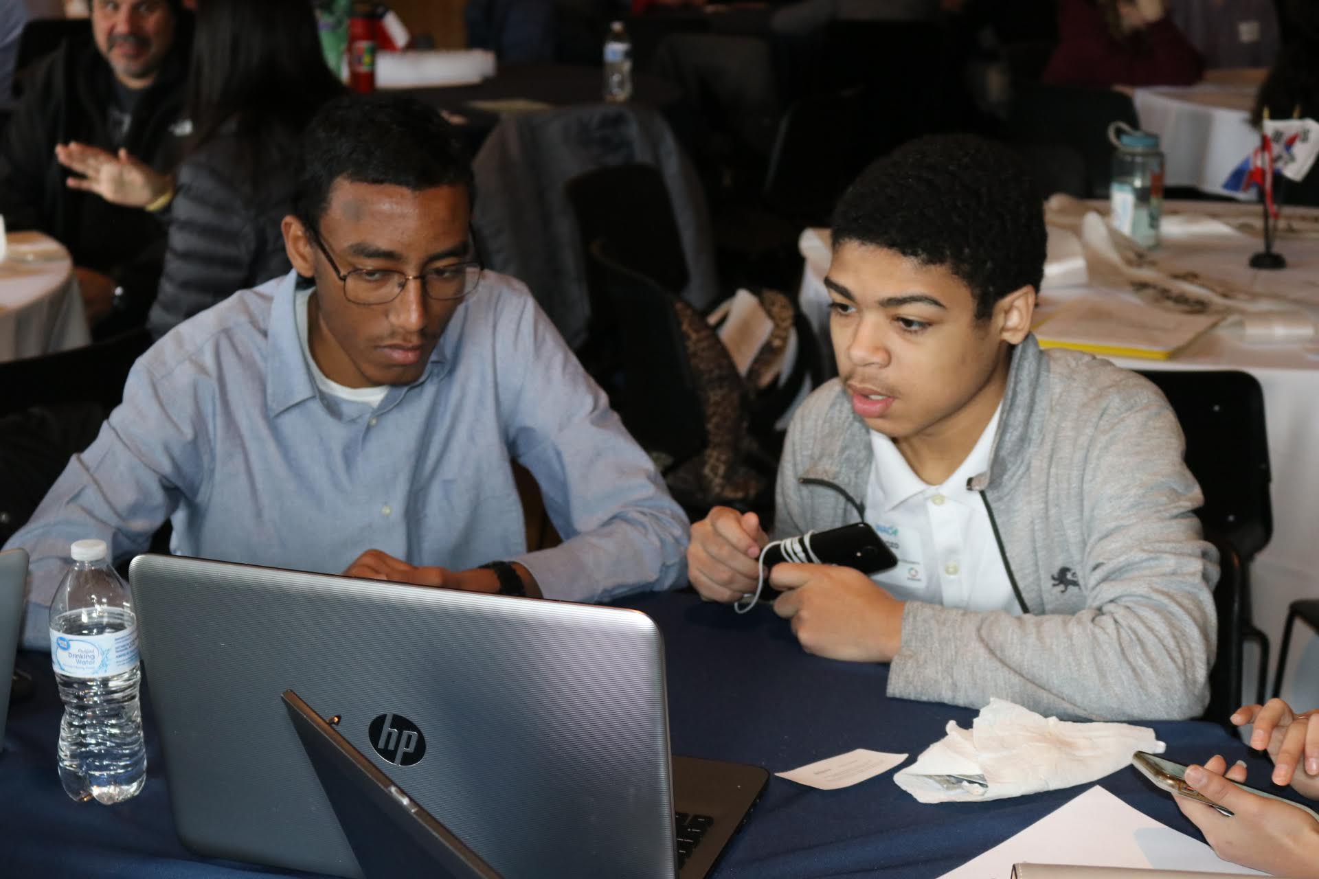 Students reviewing their presentation before their first round (FP 1).