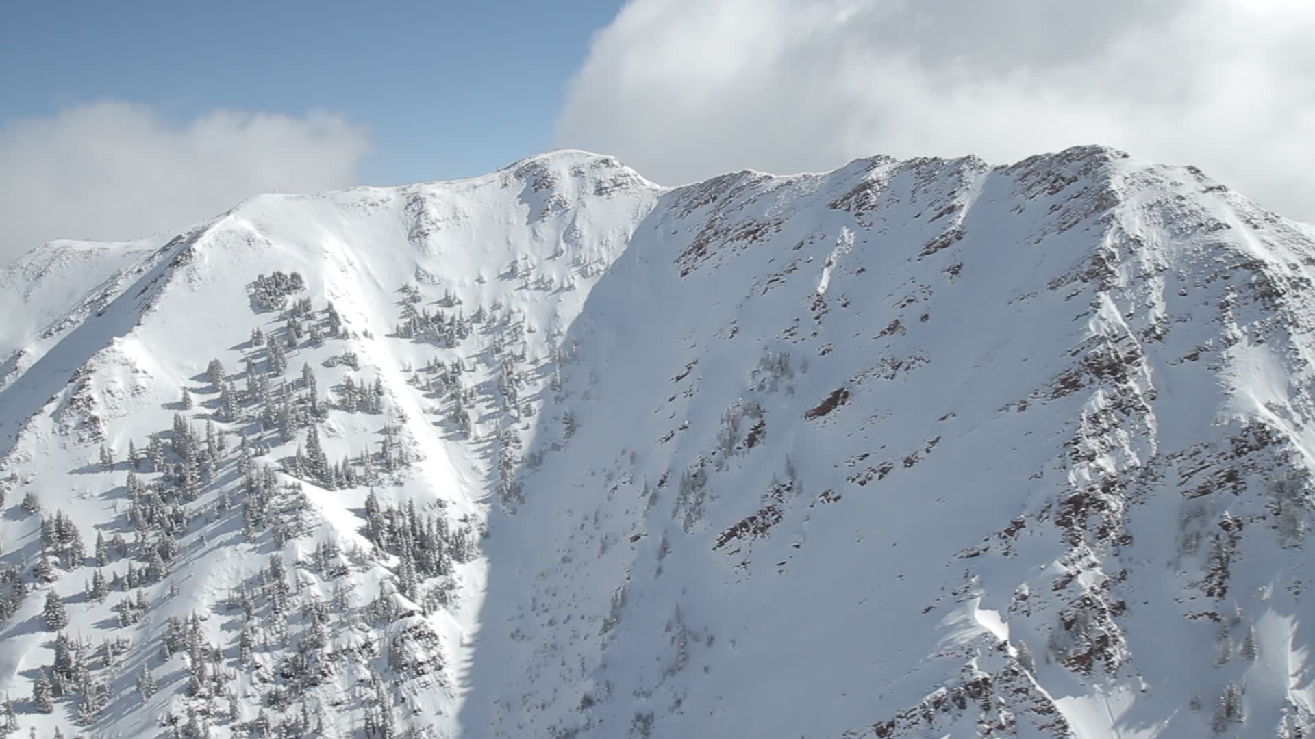 stock-footage-aspen-colorado-clouds-snow-mountains-clouds-kissing-the-peaks-of-snowy-mountains-and-hilltops-in.jpg
