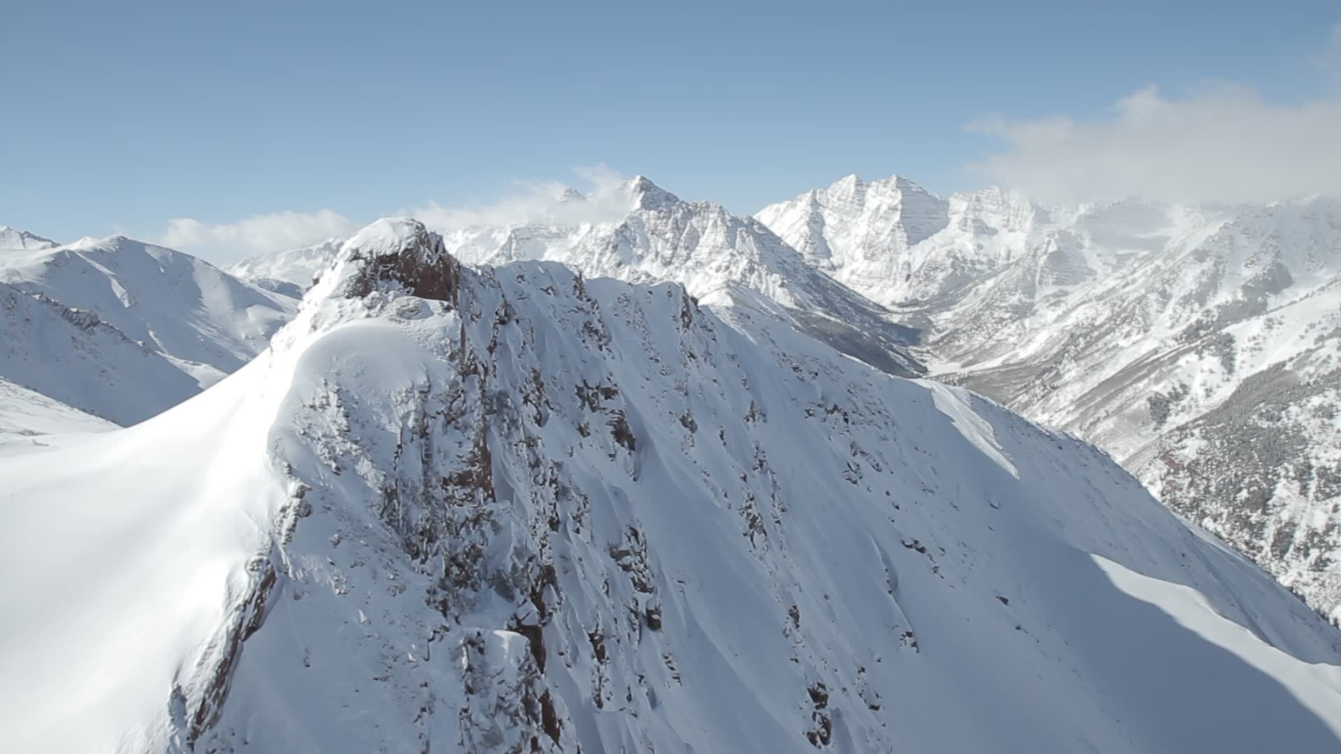 stock-footage-aspen-colorado-mountain-peaks-snowy-mountains-and-low-clouds-kissing-peaks-in-aspen-colorado.jpg