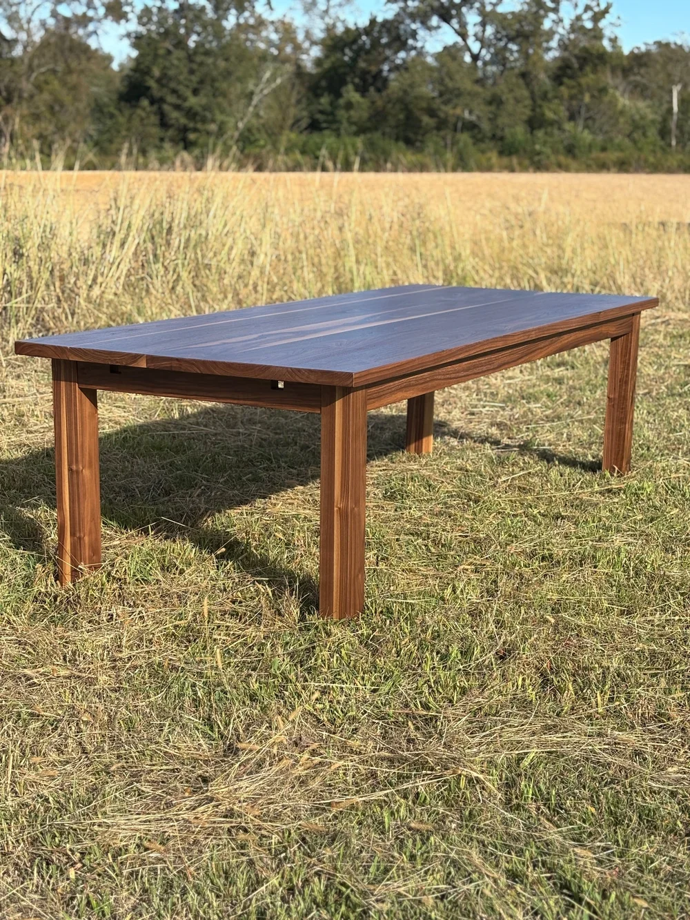 Solid wood Carolina Farmstead dining table photographed outdoors