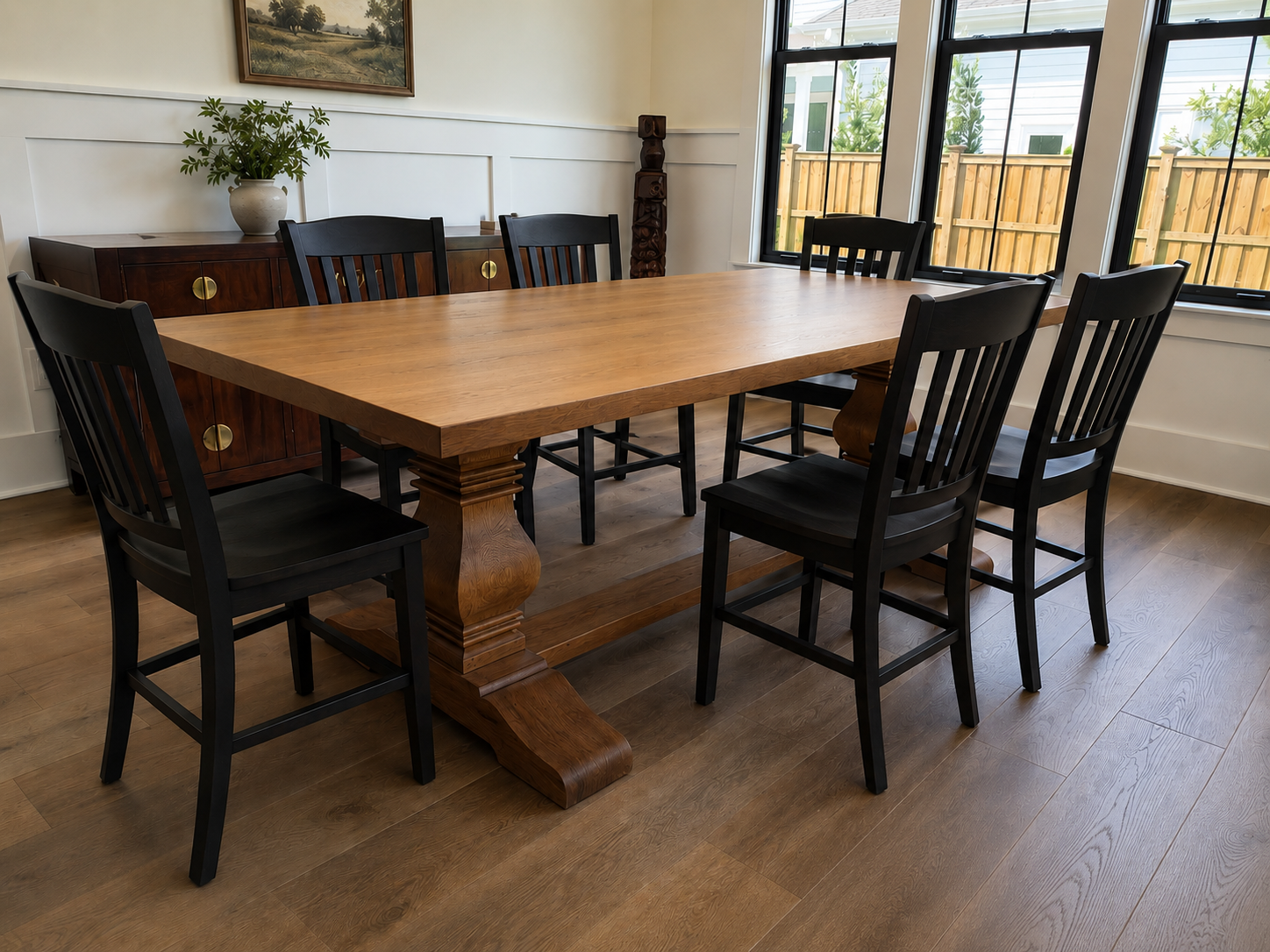 Carolina Farmstead solid wood dining table and black chairs in a finished dining room