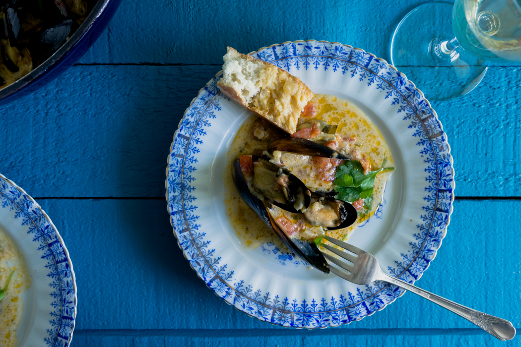 The best to eat the mussels is with crusty warm bread that you could dunk in the cream sauce.