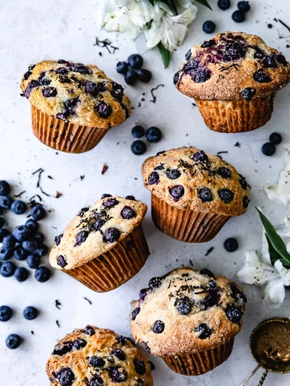 I have to say, these Jumbo Blueberry Muffins are soft, fluffy, and sooo easy to make! Everything comes together in one bowl, which we always  love. I added a little sprinkle of Earl Grey tea leaves for a soft floral twist, but it&rsquo;s totally opti