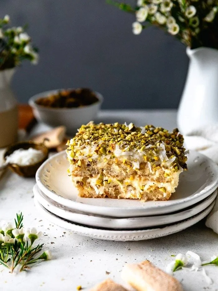 You know I always love a fresh spin on a classic, and this Coconut Tiramisu feels extra special! It&rsquo;s light, creamy, and layered with coconut flavor throughout. The shredded coconut adds just the right texture, while the pistachios bring that p