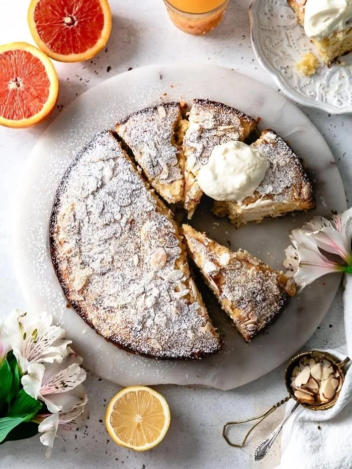 Save this soft, fluffy and seriously irresistible Lemon Orange Ricotta Cake right now! It melts in your mouth with bright citrus flavor and rich, creamy ricotta. A touch of olive oil, vanilla, orange blossom water, and almond makes every bite feel ex