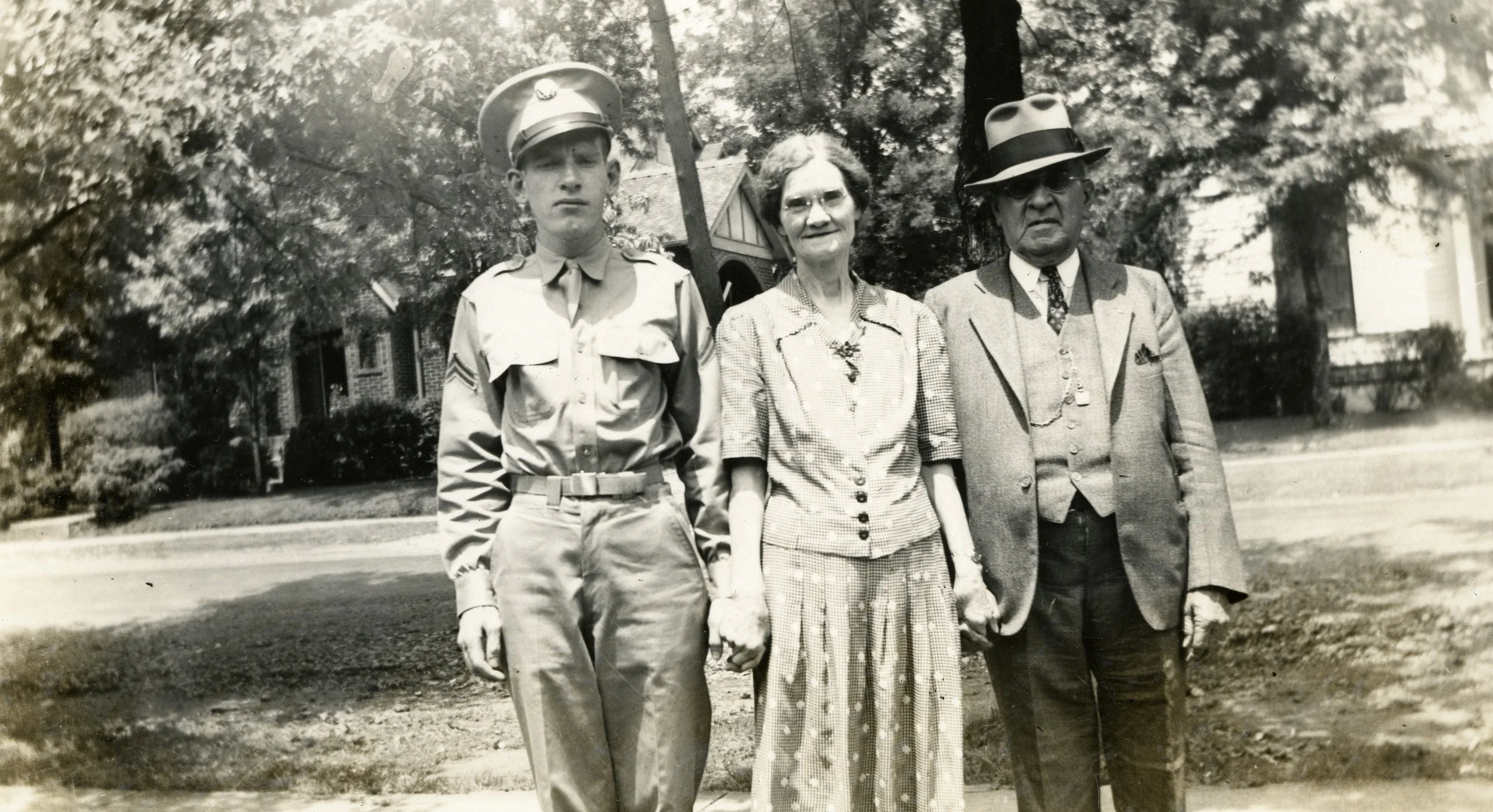 James Henry Kilgore., 1942 (age 23) in uniform preparing to serve in WWII in Italy. Mr. Kilgore is shown here with his mother, Irene Watkins Kilgore and his father, James Henry Kilgore Sr.