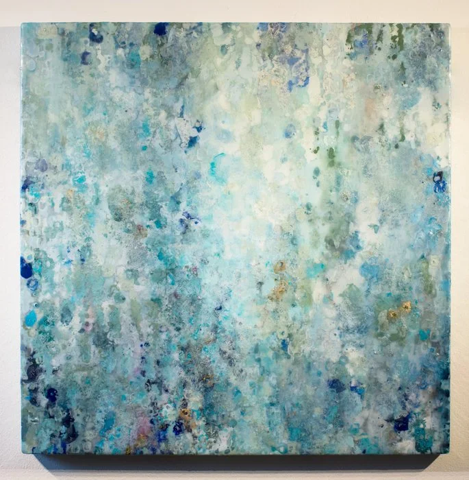 Abstract painting with blue, green, and white splashes and textures.