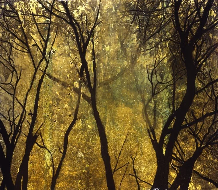 A view of trees with dark, leafless branches against a yellowish, luminous background resembling a forest or park illuminated by sunlight or artificial light.