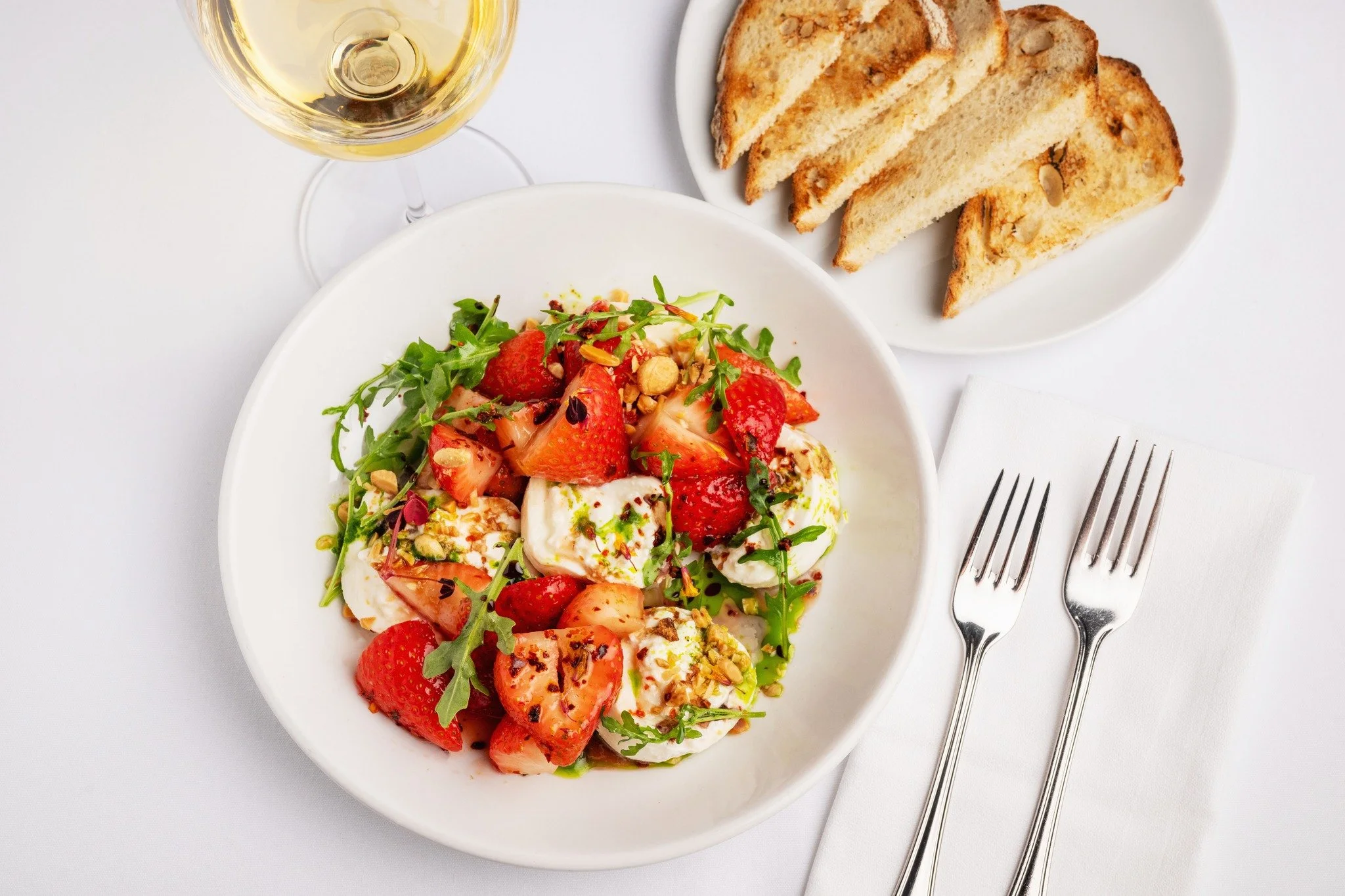 Burrata &amp; Tokaji Macerated Strawberries: Saba, Basil Coulis, Arugula, Marcona Almonds, Toasted Bread

📷: @aubrie.legault