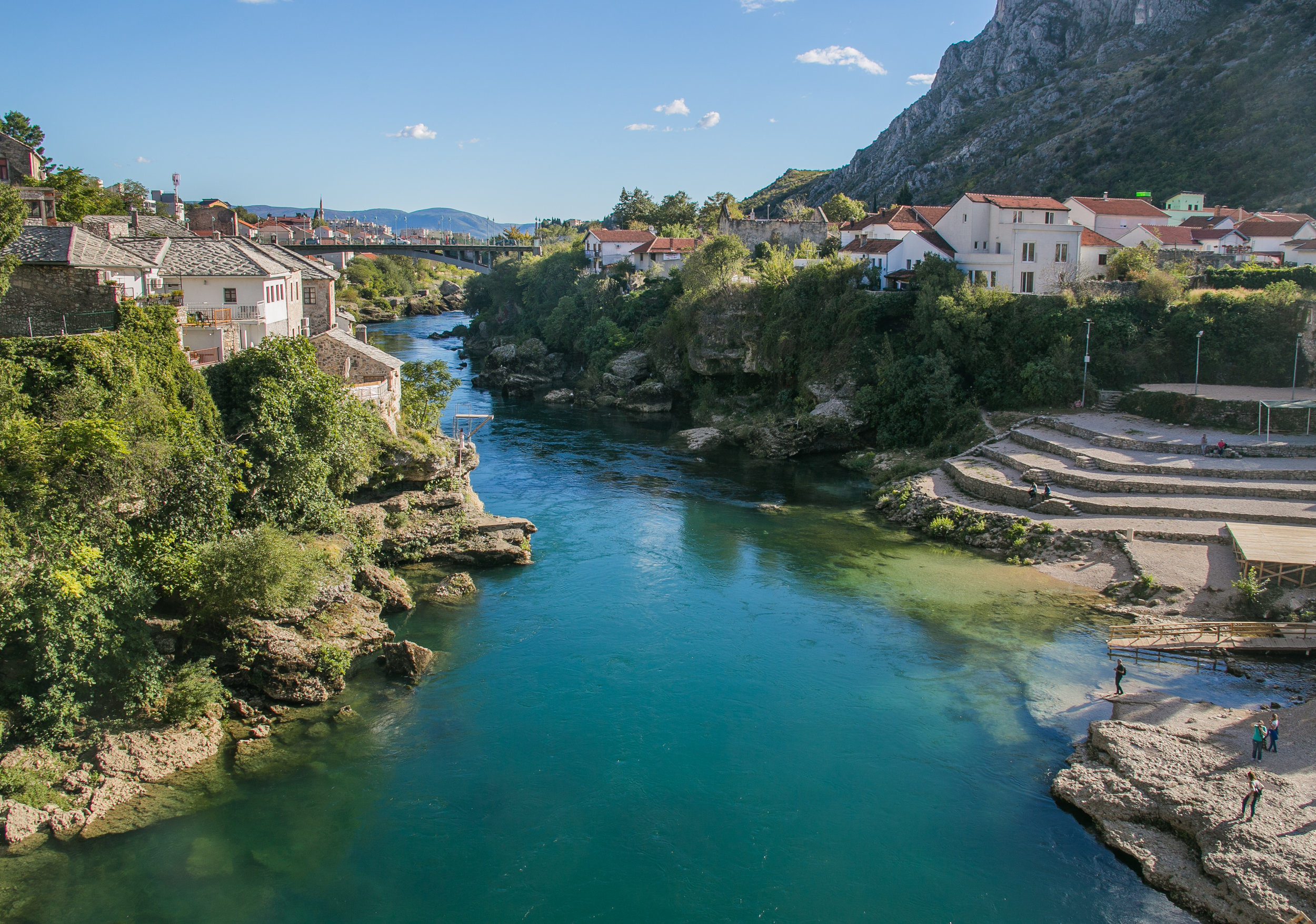  The Radoblja River weaves through the city of Mostar, Bosnia. The small diving board on the left riverbank is used as a practice grounds for the Bosnian diving team. For 30 euro you can complete a training course and jump off the over 70-foot histor