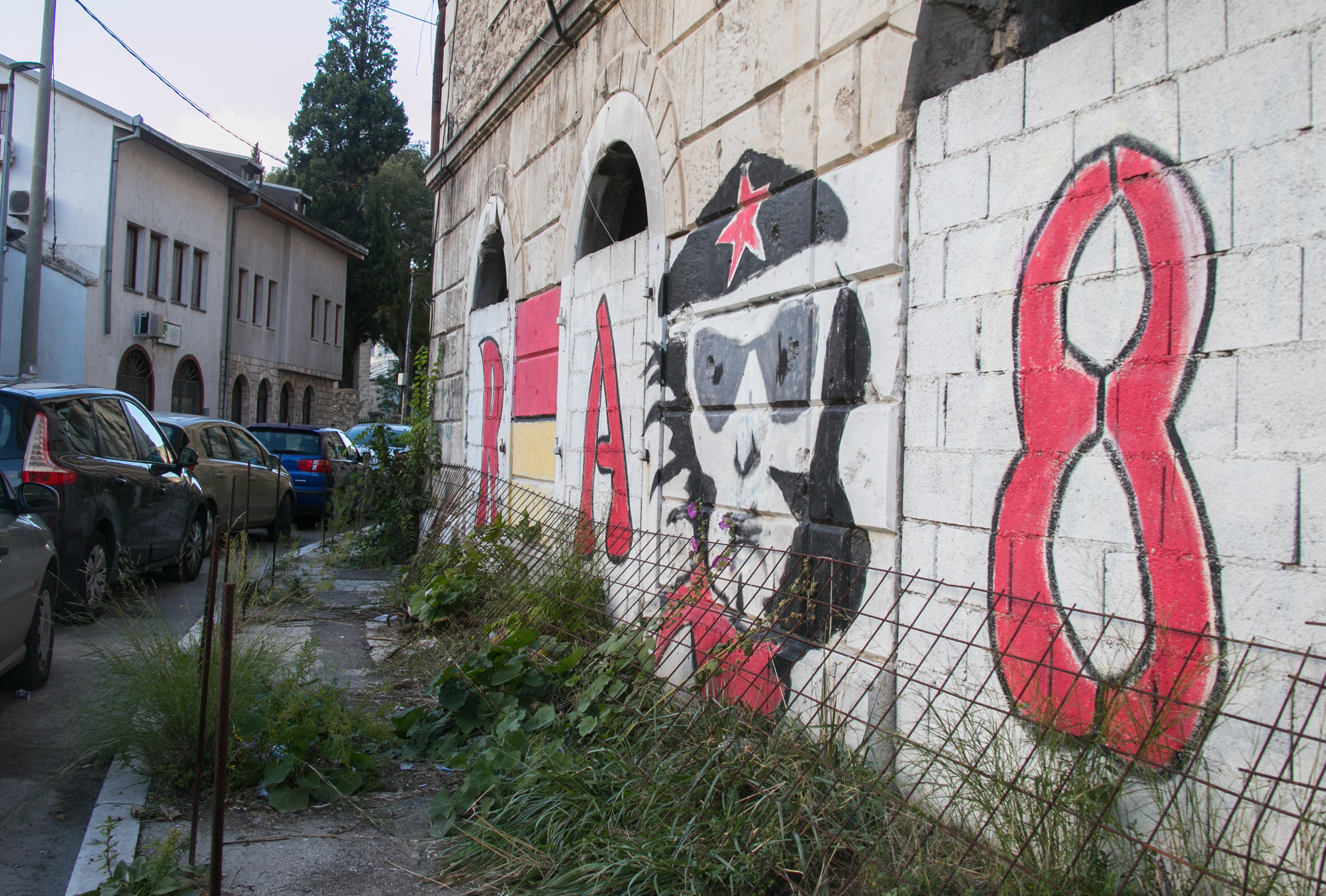  Graffiti tags on the side of a blown out building left over from Bosnian War times.&nbsp; 