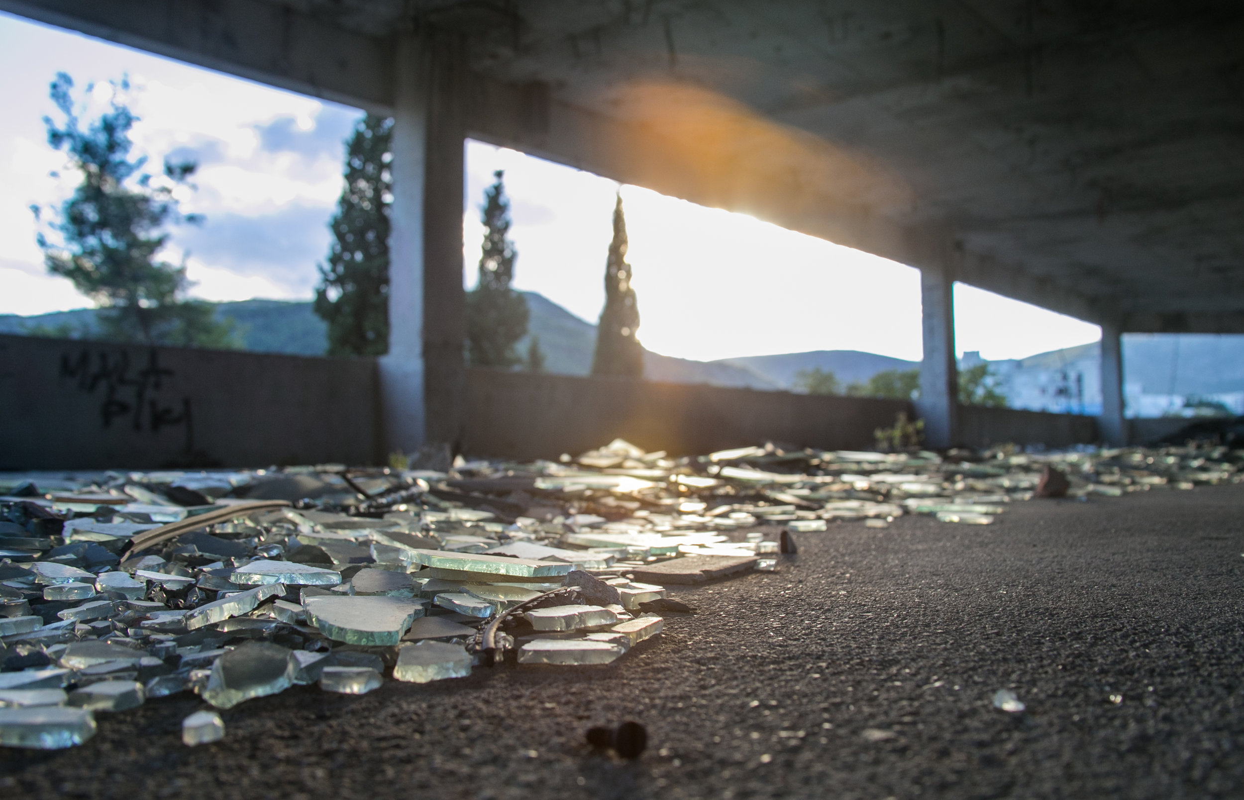  Shattered glass riddles the floor of an abandoned sniper tower left over from the Bosnian War in Mostar, Bosnia.&nbsp; 