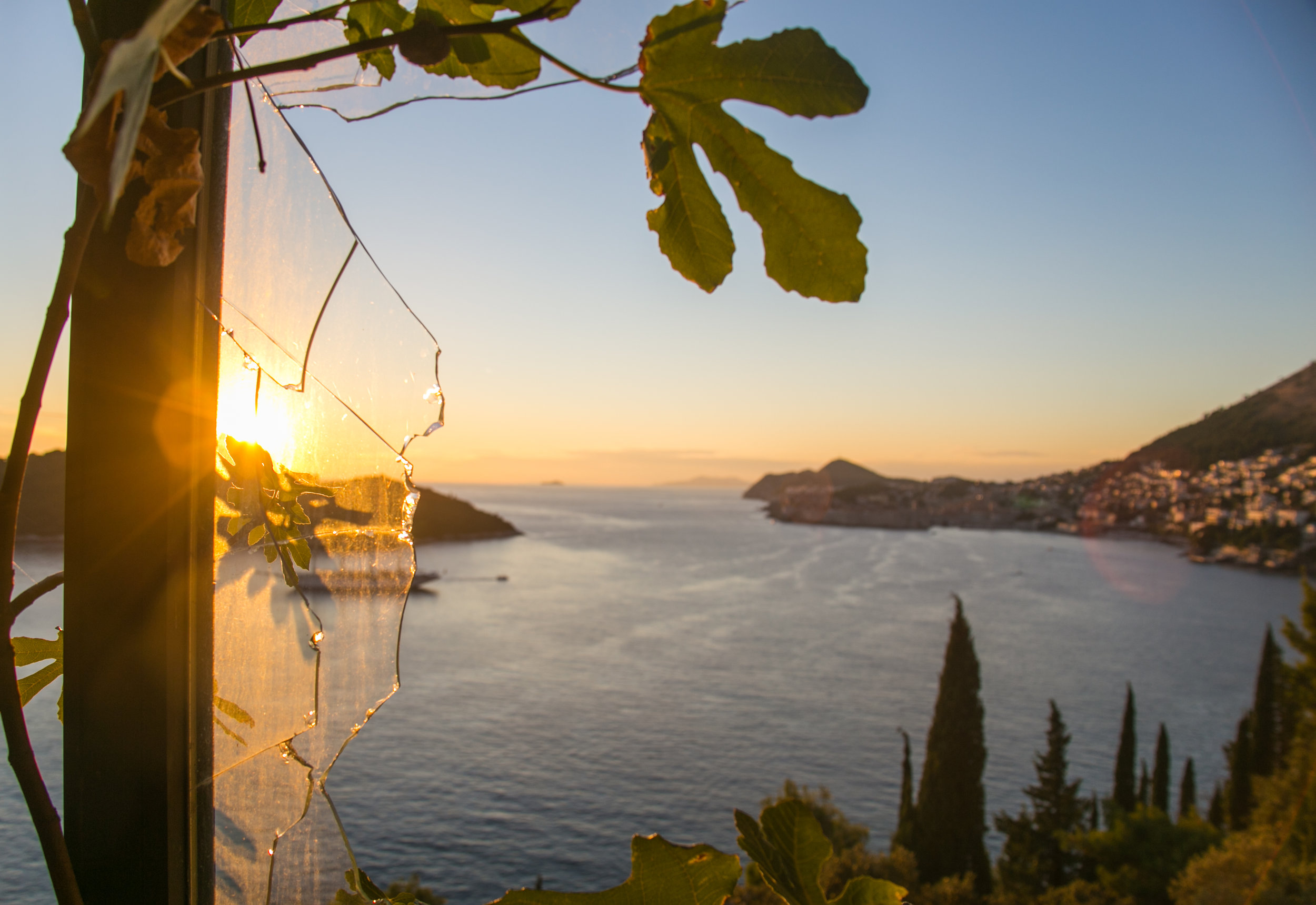  The sun sets over anchored sailboats in the bay of Dubrovnik. Photographed from the shattered windows of the Belvedere Hotel in Dubrovnik,&nbsp;Croatia. The five-star hotel was opened in 1986, only to be closed 6 years later due to bombings during C