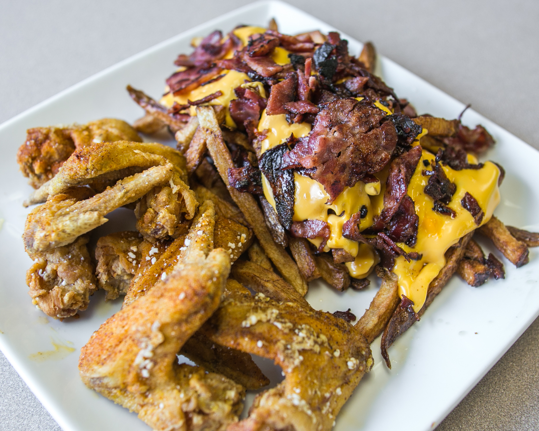 Shuman's Homewood_Fried Chicken Wings with Beef Bacon Cheese Fries_native_-3.jpg