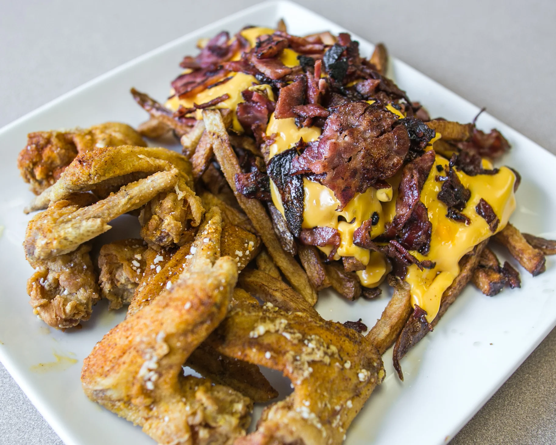 Shuman's Homewood_Fried Chicken Wings with Beef Bacon Cheese Fries_native_-3.jpg