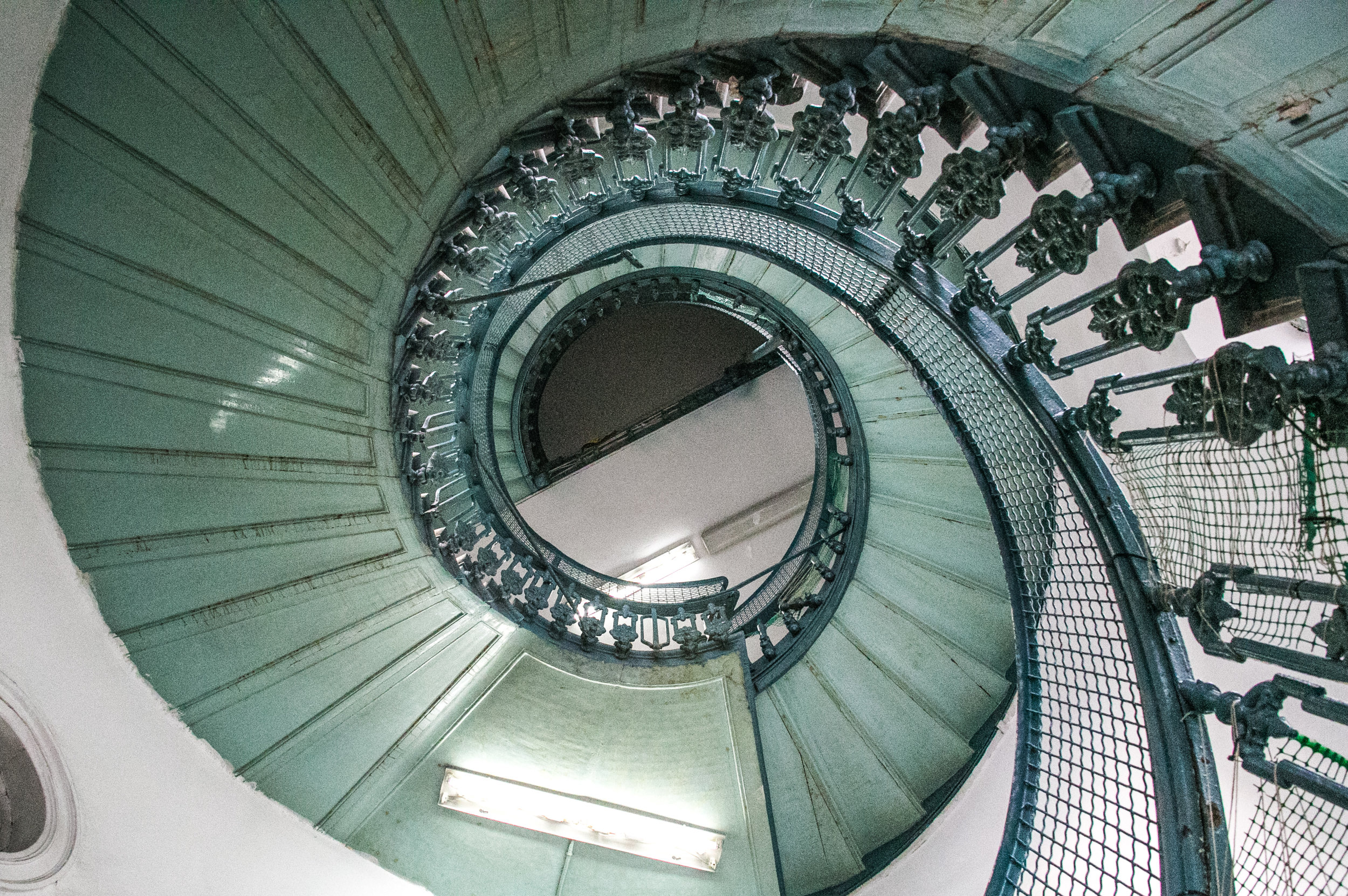  10/13/16 - The main spiral staircase of Jasmine School is lined with chicken wire to prevent children from falling through the gaping holes in the railing. 