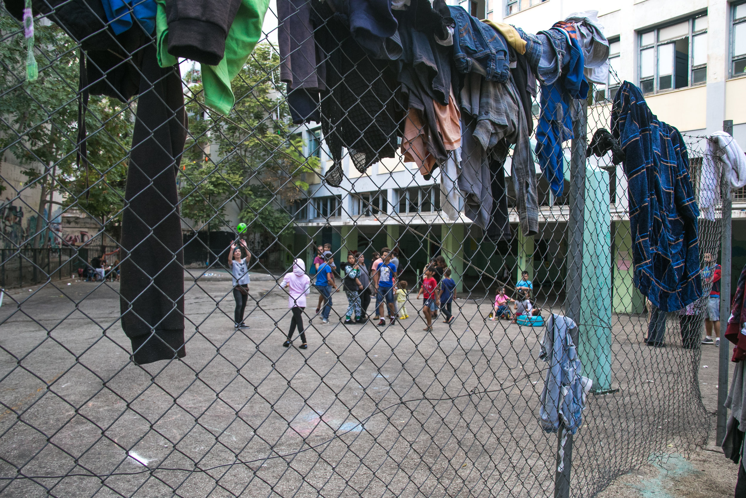  10/17/16 - Children play in the courtyard of the once-abandoned Jasmine School Refugee Squat. 