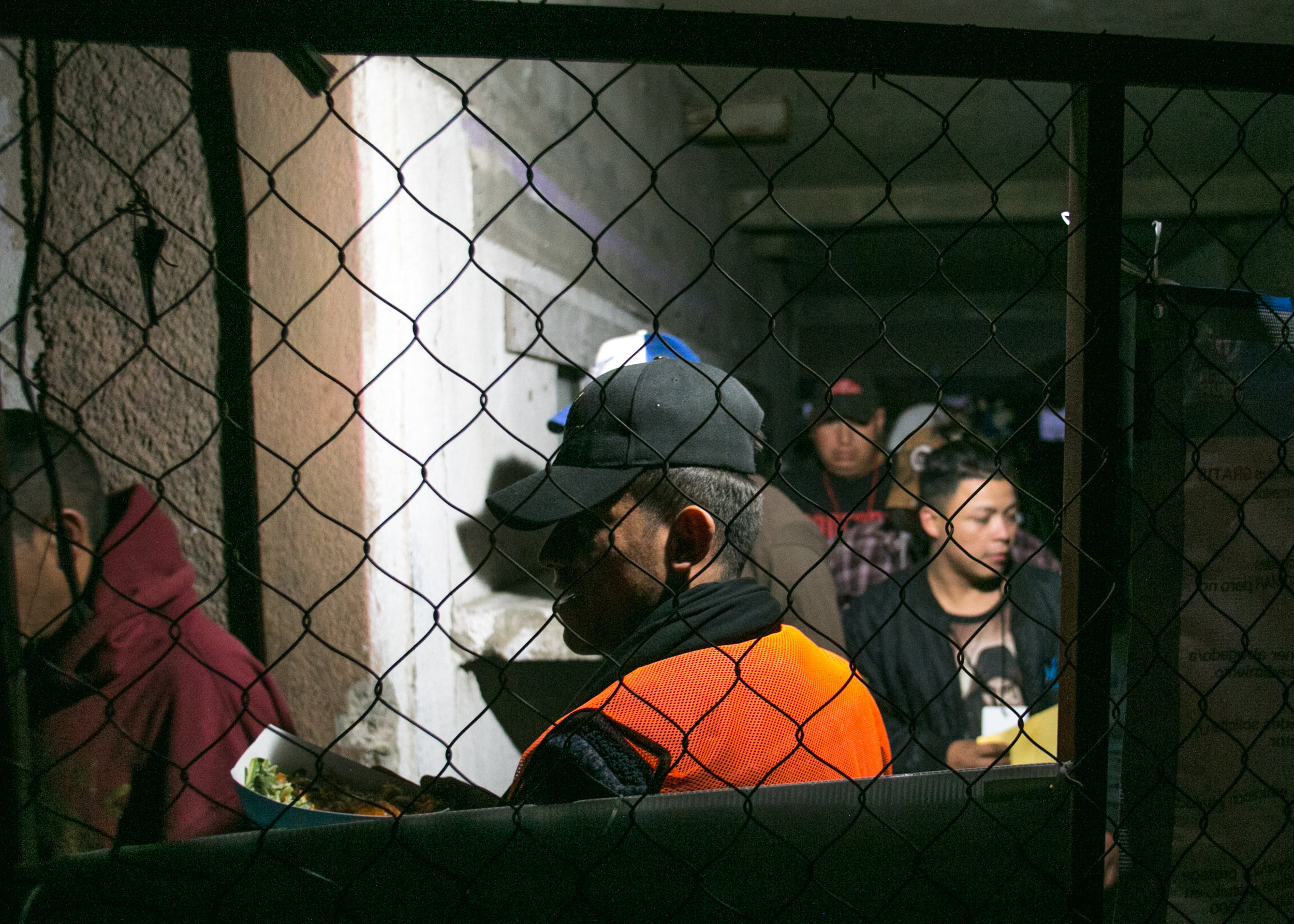  Refugees from the male portion of the compound eagerly wait their turn to enter the family side of the facility for dinner. Each night World Central Kitchen served between 1,200 and 1,500 meals. The line stretched over 100 yards in the other directi