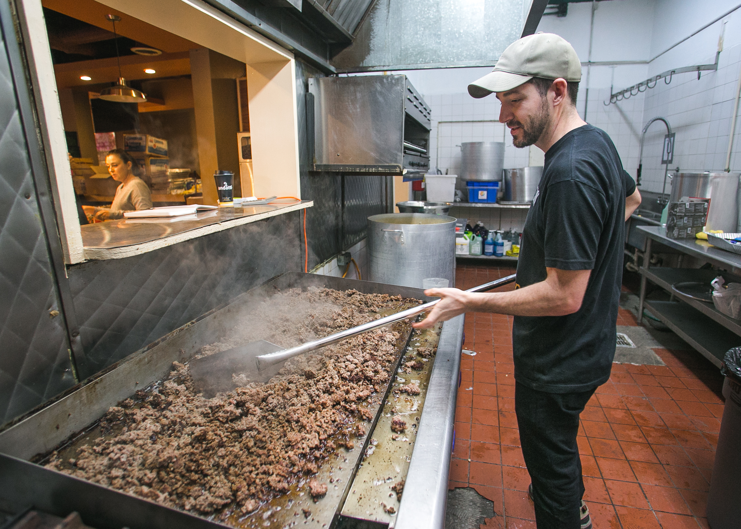  Brenden Darby, 28, of San Francisco cooks over 30 pounds of beef in the World Central Kitchen headquarters in Tijuana. The meat will be served as part of dish for dinner at the Barre Tal refugee camp. World Central Kitchen, Chef Jose Andres’ non-pro