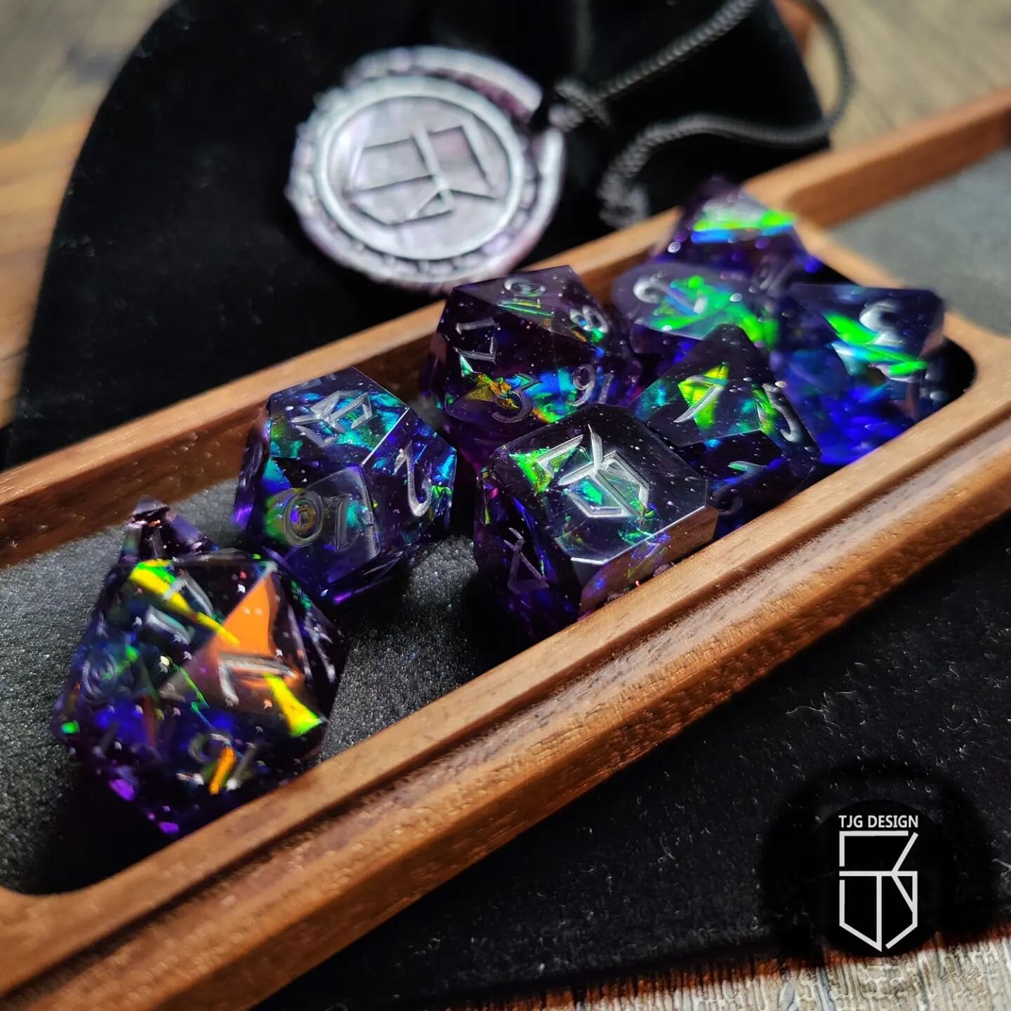 Hey folks!  I wanted to share some detailed photos of my Aurora Borealis Dice along with my Mango Wood Dice Case.  Really pleased with how these have turned out!

#workshop #dnd #tabletopRPGs #dice #dicemaking #rpgdice #dnddice #dicedesign #resin #re