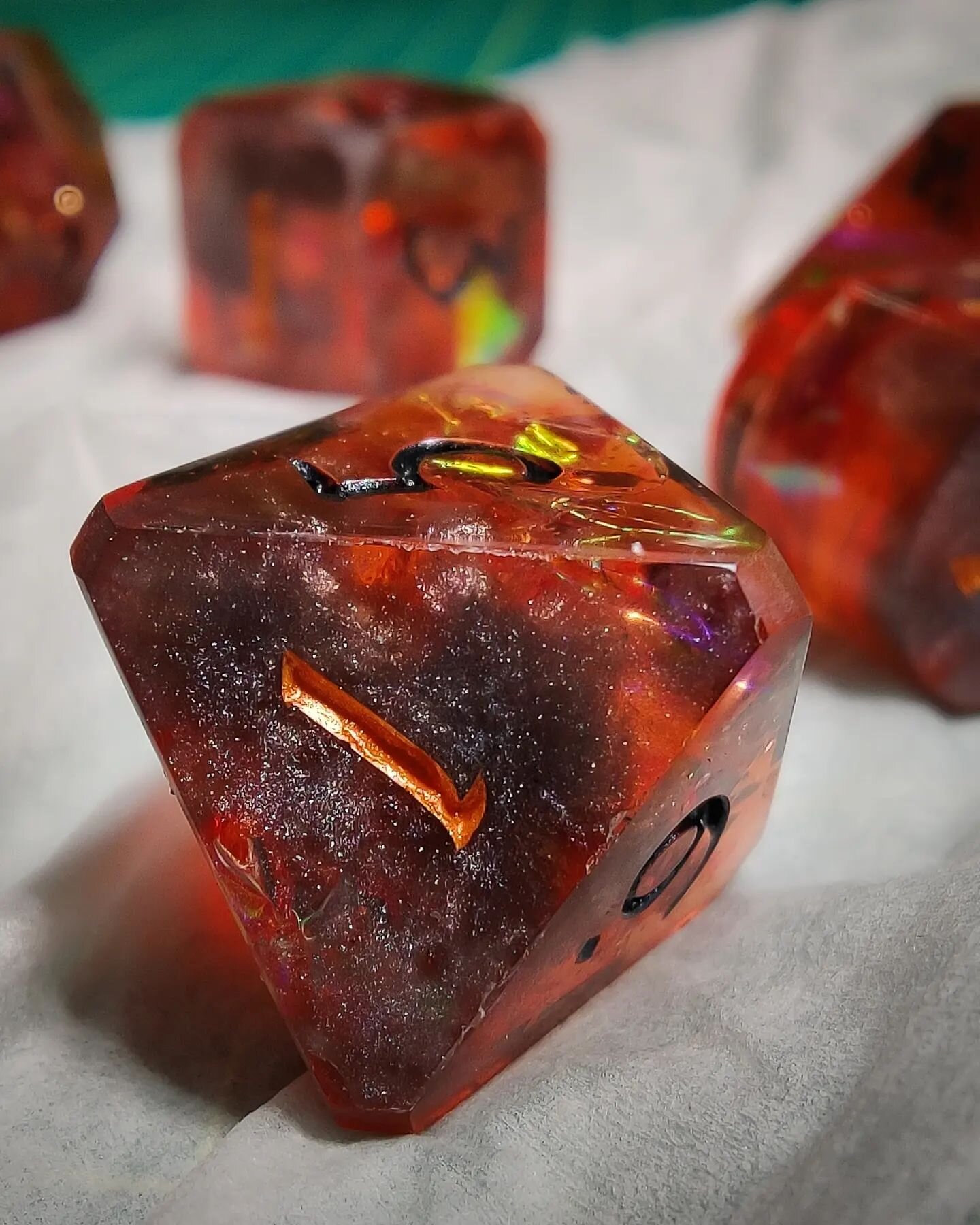 Another sneak peak...not as mysterious as my last post, so no guesses necessary here, but I'm really really pleased with how these dice are looking so far!!

#workshop #dnd #tabletopRPGs #dice #dicemaking #rpgdice #dnddice #dicedesign #resin #resindi