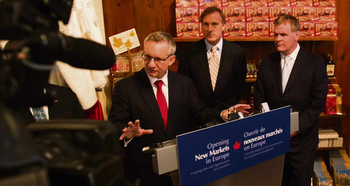 Ed Fast, Minister of International Trade, gives details of a cross-Canada tour to promote the benefits of the Canada-EU trade agreement while John Baird, Minister of Foreign Affairs (right), and Maxime Bernier, Minister of State (Small Business and Tourism, and Agriculture), look on. Deb Ransom