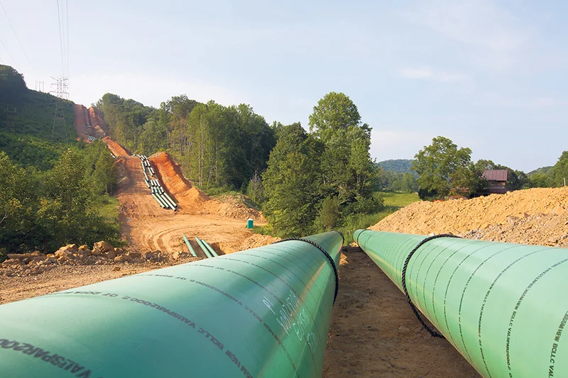 Pipelines, like those constructed by Spectra Energy (top), are the type of infrastructure that’s crucial to Canada’s oil export efforts, say Energy Roundtable president Jason Langrish (bottom left) and Barry Munro, leader of the oil and gas practice at EY in Canada. Spectra; Michelle Siu; EY