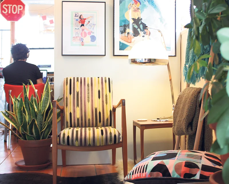 Two work spaces and an office in a 1,000-square-foot home studio? Wood artisan Meredith Nicole and artist Mark Henderson (her Finn chair and prints of his large-scale paintings, bottom) make it work. Jennifer Shanse