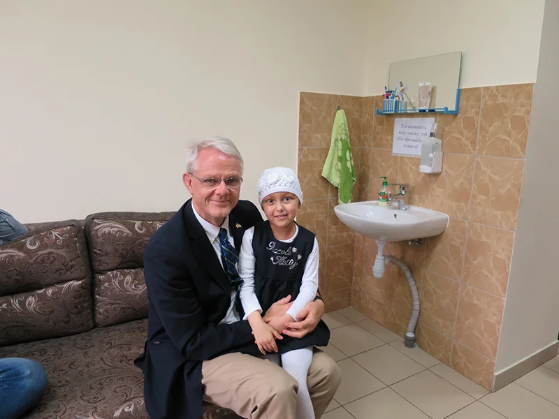 Dr. James Rutka with a young patient in Ukraine. supplied