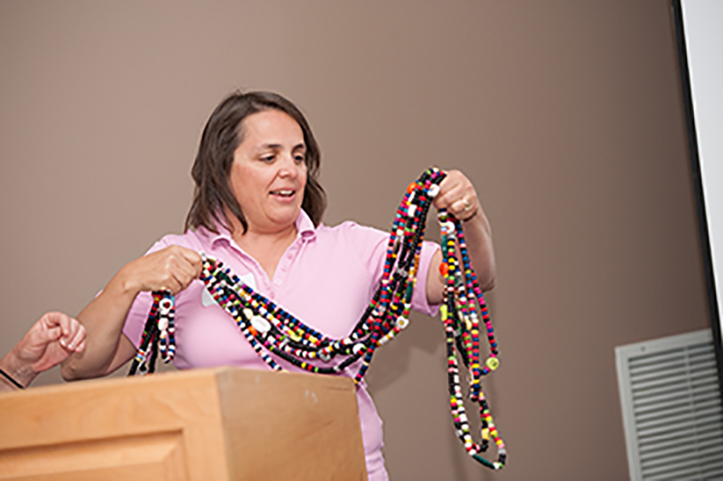 Liset Stanton holds up her son Daniel’s ‘bead story’ – each bead representing a step toward recovery from leukemia: a bead for each blood transfusion, a bead for each round of chemotherapy, a bead for the stem cell transplant. supplied