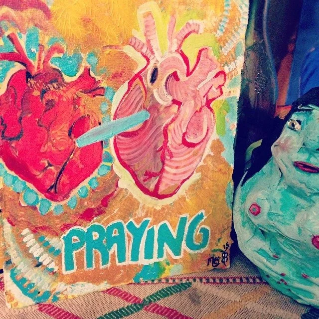 Praying for Wesley next to Kali Ma, my worry eating doll - Meghan Yates 3/22/15 