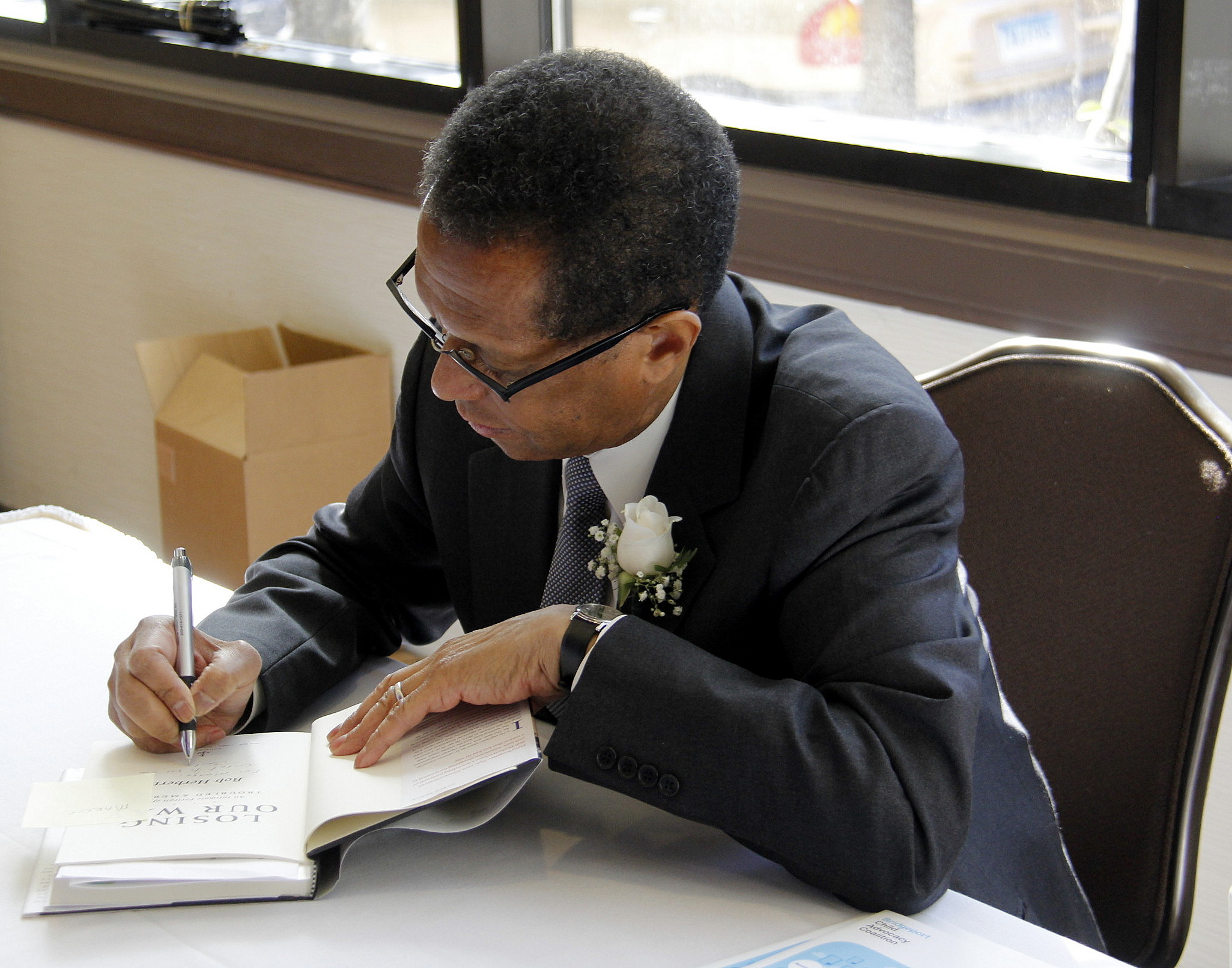  Keynote speaker Bob Herbert signing books 