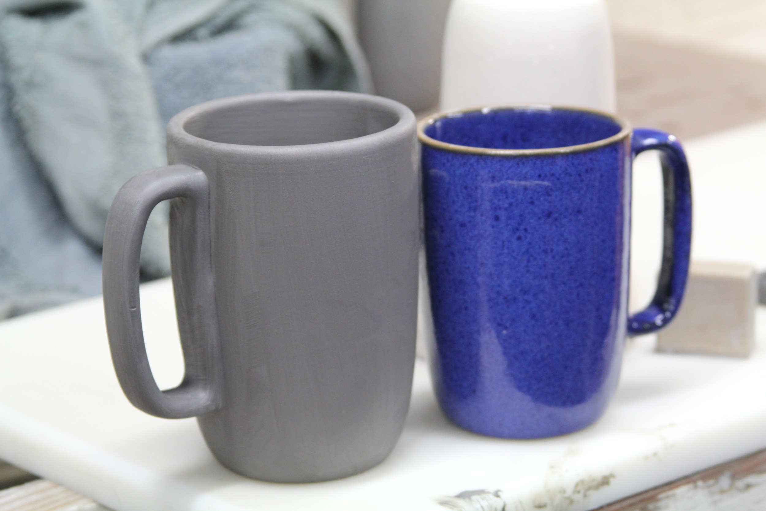  The mugs shrink significantly in size after a firing in the kiln.&nbsp; 