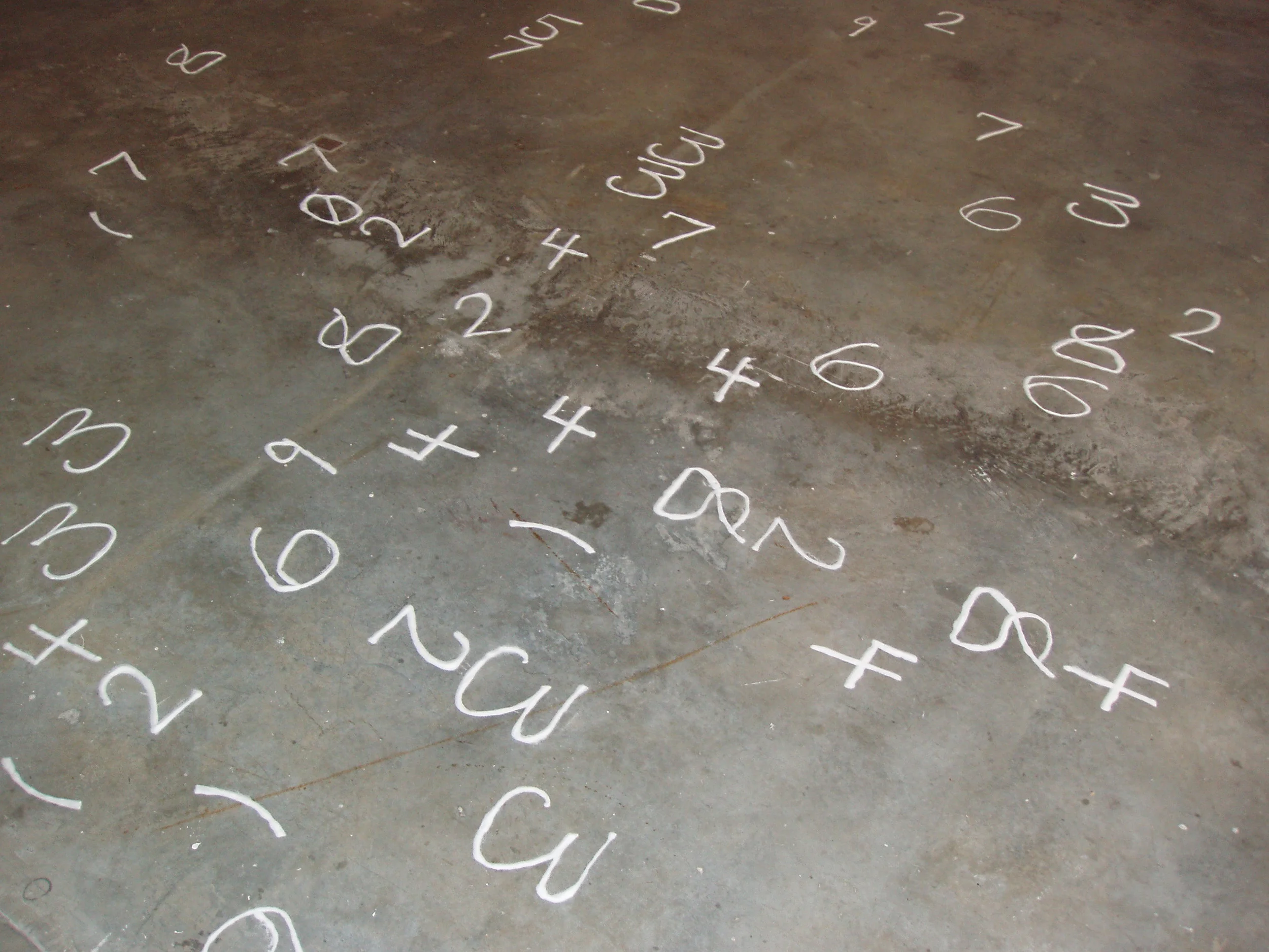 ≥Hippasus of Metapontum is an installation in the form of the √2 stenciled on the gallery floor in salt. The number, 1.4142..., begins at the gallery door and loops, ever tighter, as it draws nearer to the center of the gallery. I chose salt as my material because salt crystals are perfect squares and because Hippasus found his end among much salt. The installation asserts that this number (shown in the gallery to 159 digits) was, at his time and in his place, ≥ Hippasus of Metapontum. 