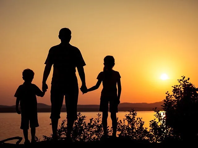 father-and-children-at-sunset.jpeg