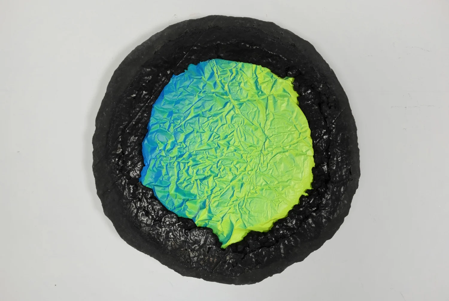 Textured concentricretion with blue and yellow