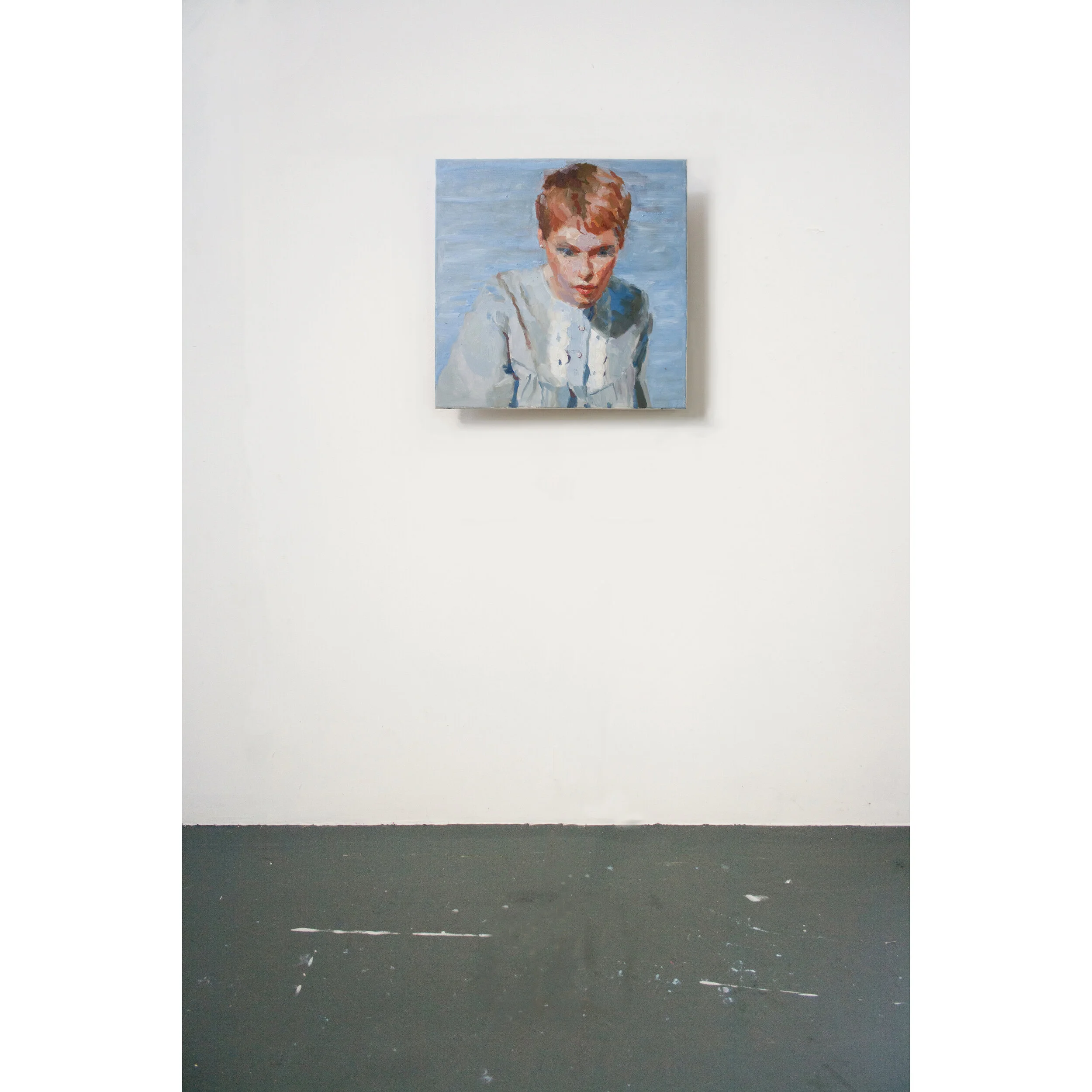 Mia in blue looking down in studio.jpg