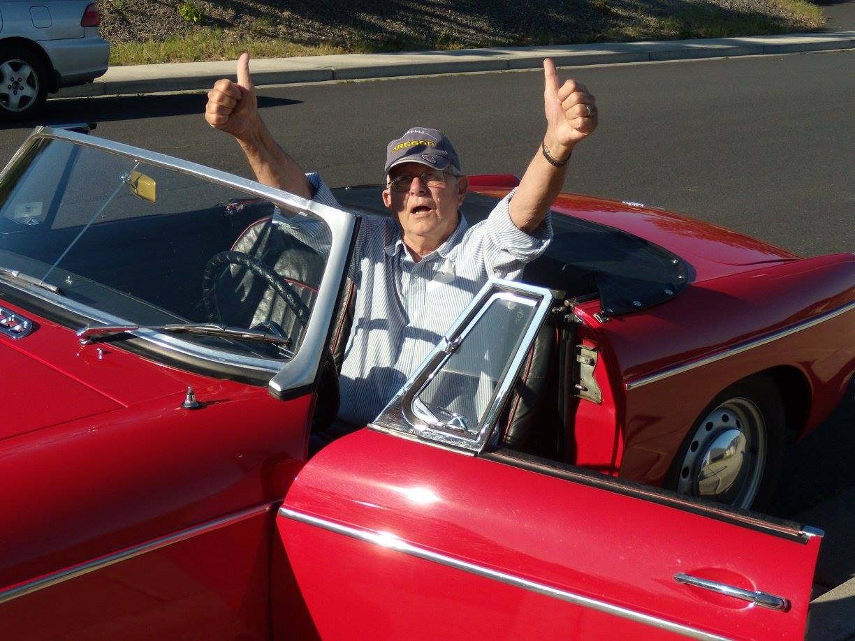 My dad in his beloved MG (and ragged Oregon ducks hat that didn't leave his head for oh, about ten years) that he restored.