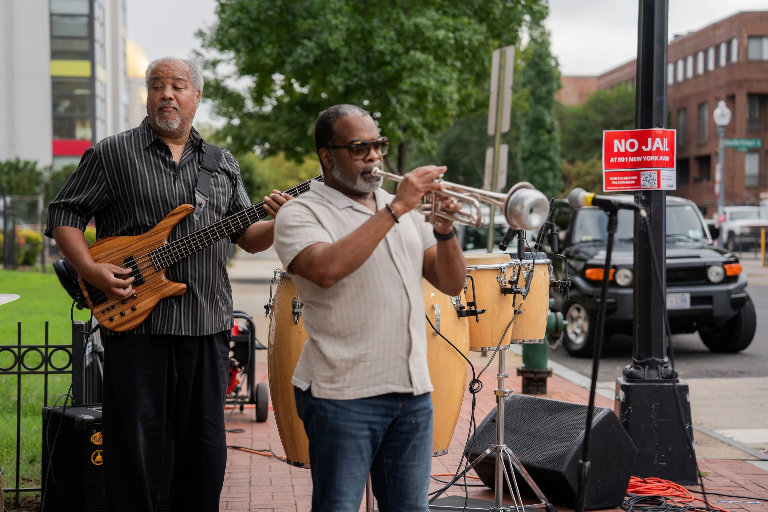 2 musicians playing trumpet and guitar
