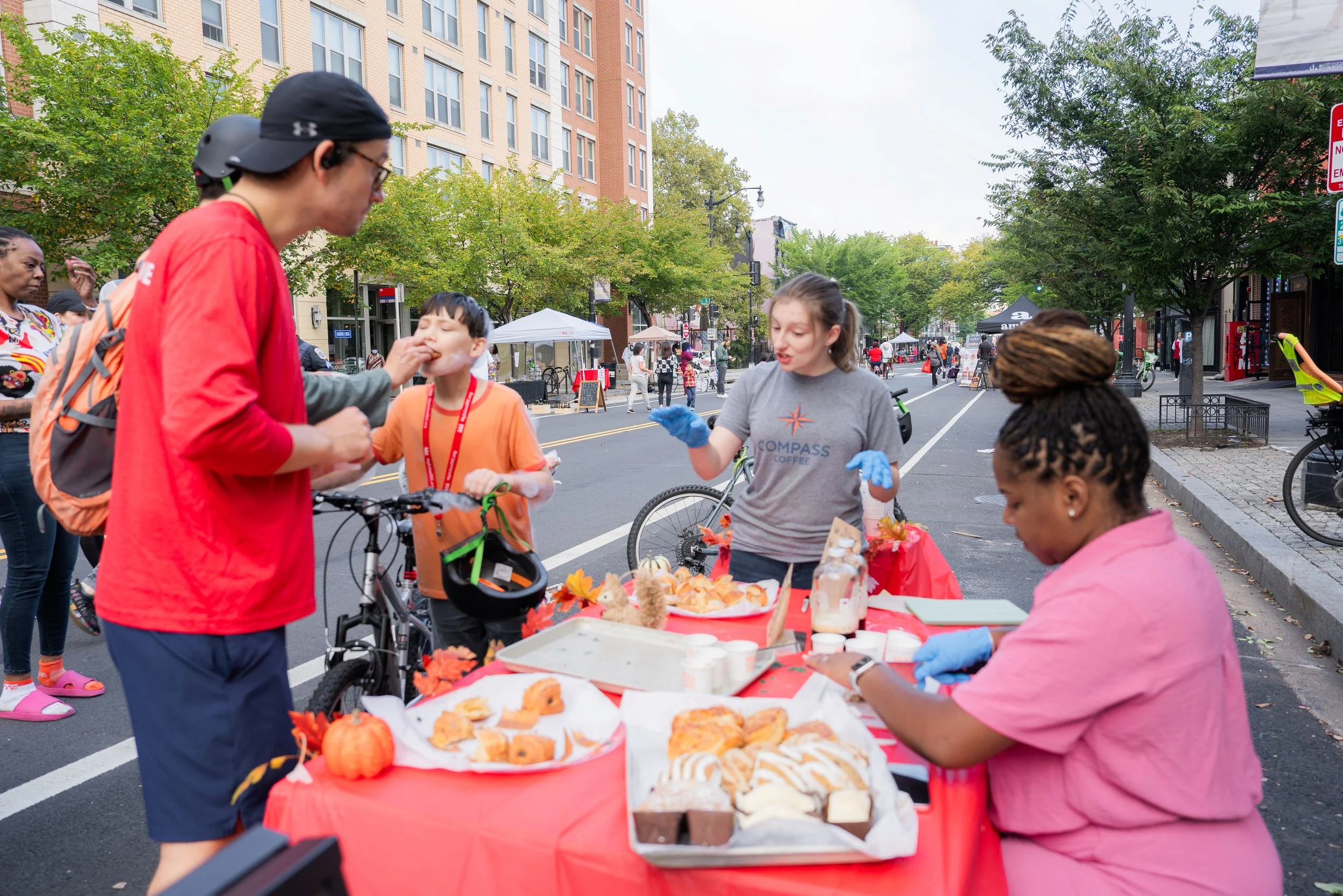 People eating from a vendor